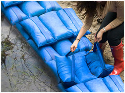 How do Hydrosacks prevent flooding